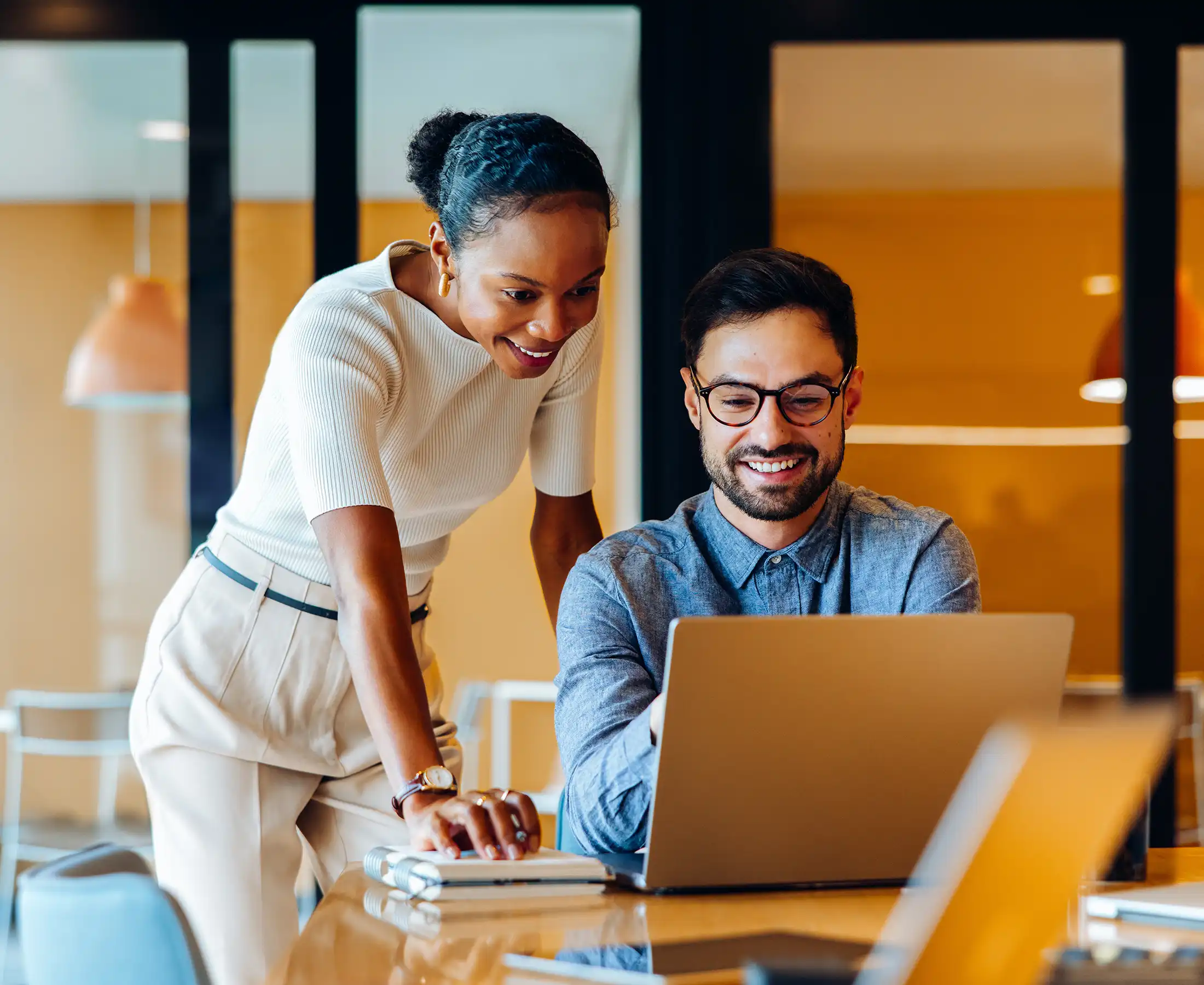 Smiling colleagues discussing project ideas